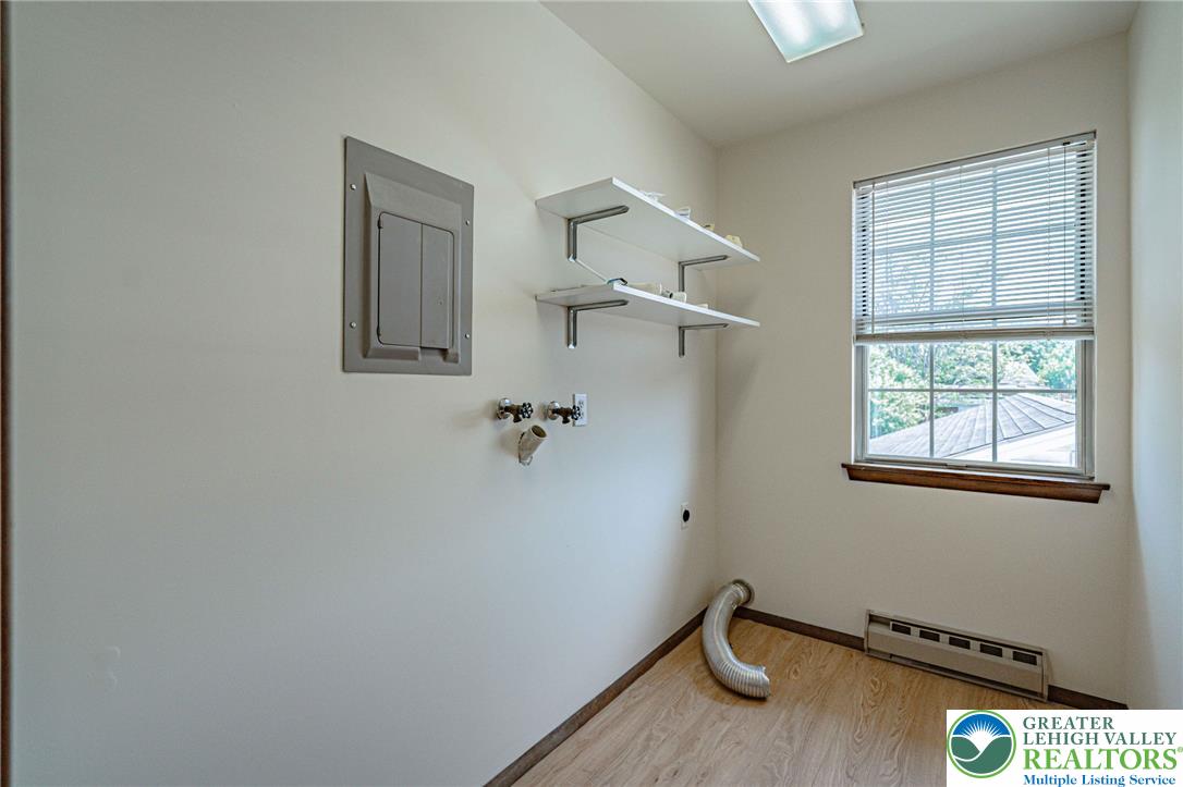 25 North 8th Street Emmaus, PA 18049 - Photo 31 of 51 Functional utility space with natural illumination and convenient shelving for household organization.