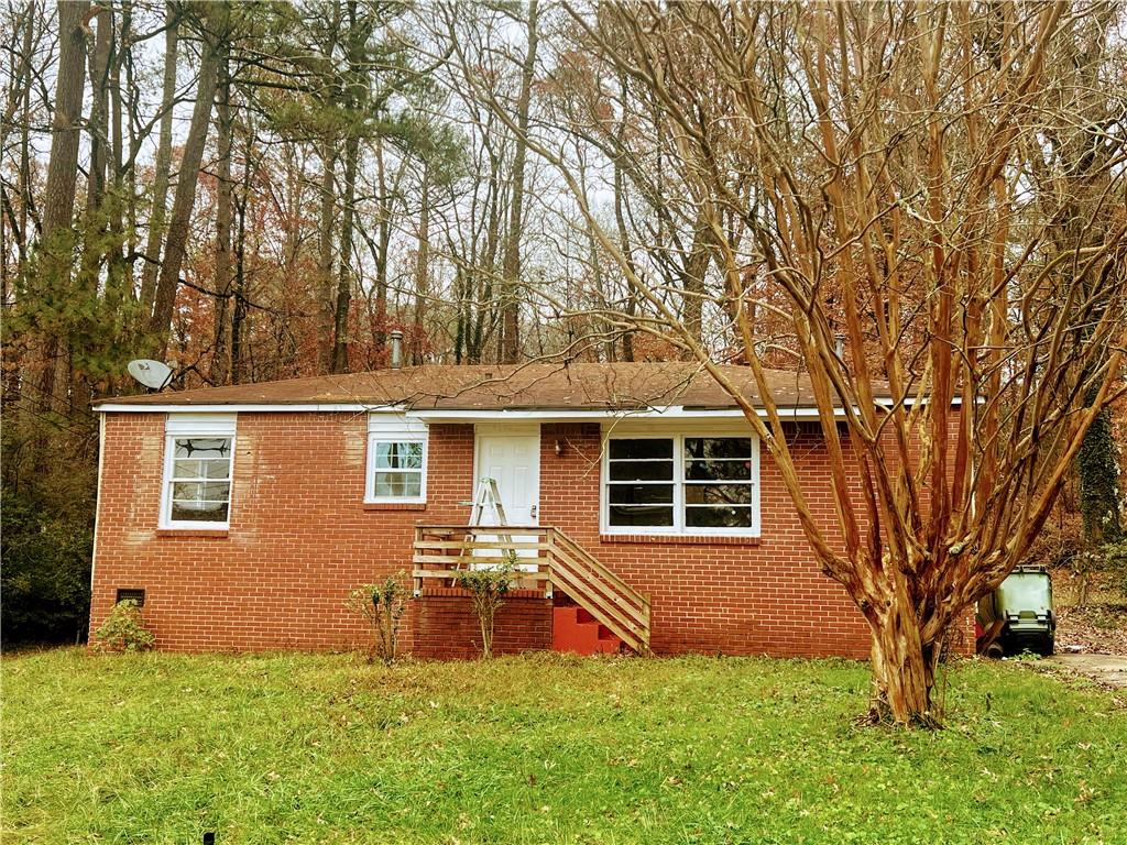 front view of a house with a yard