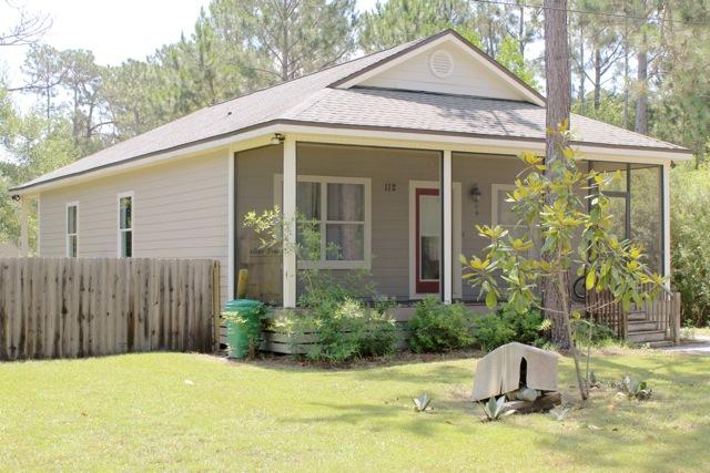 112 11th Street Santa Rosa Beach, FL 32459 - Photo 2 of 4 a front view of a house with garden
