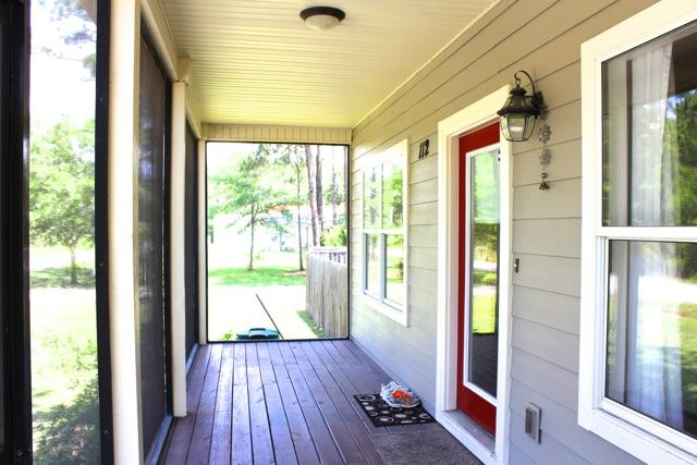 112 11th Street Santa Rosa Beach, FL 32459 - Photo 3 of 4 a view of an entryway with wooden floor and windows