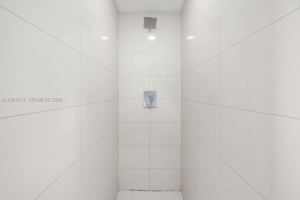 650 Northeast 32nd Street, Unit 2205 Miami, FL 33137 - Photo 25 of 56 a bathroom with a shower