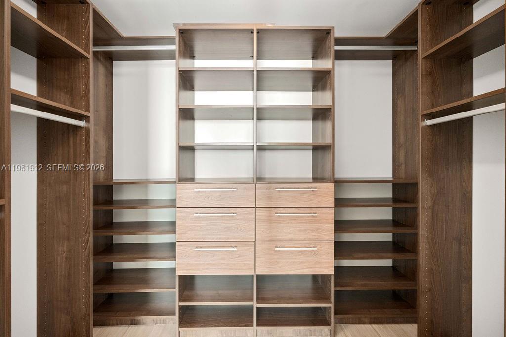 650 Northeast 32nd Street, Unit 2205 Miami, FL 33137 - Photo 26 of 56 a view of walk in closet with empty racks