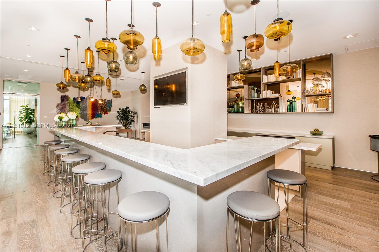 650 Northeast 32nd Street, Unit 2205 Miami, FL 33137 - Photo 34 of 56 a kitchen with a table and chairs in it