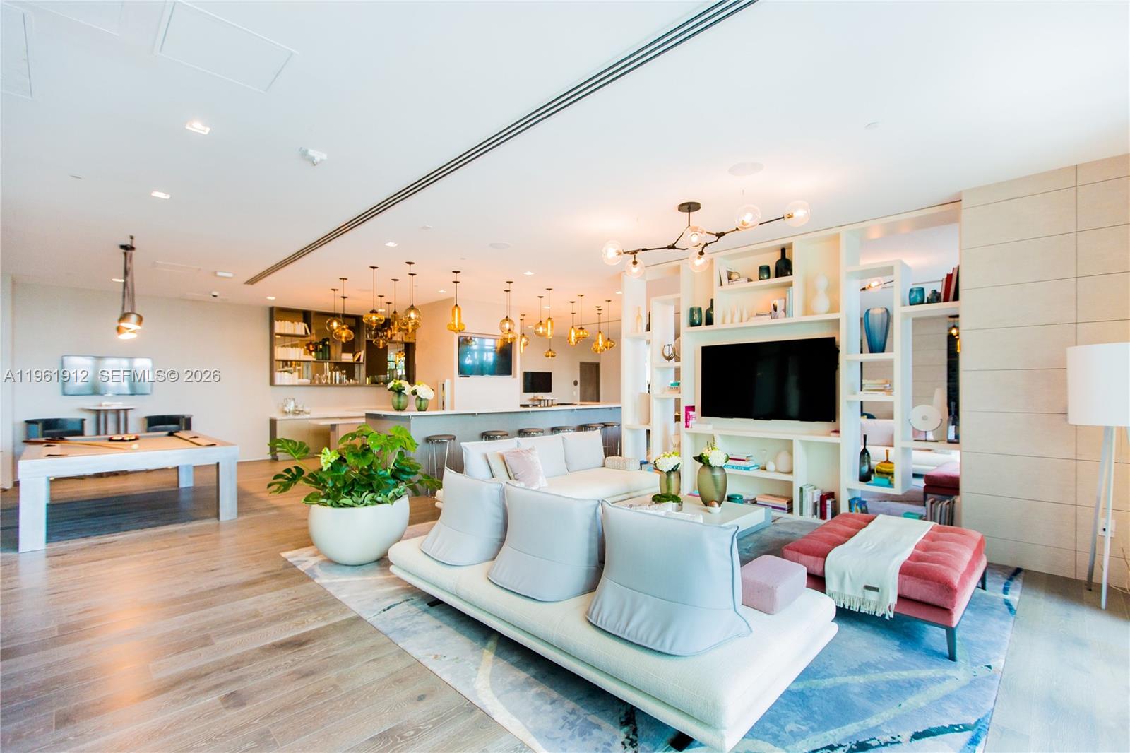 650 Northeast 32nd Street, Unit 2205 Miami, FL 33137 - Photo 36 of 56 a living room with furniture and a flat screen tv