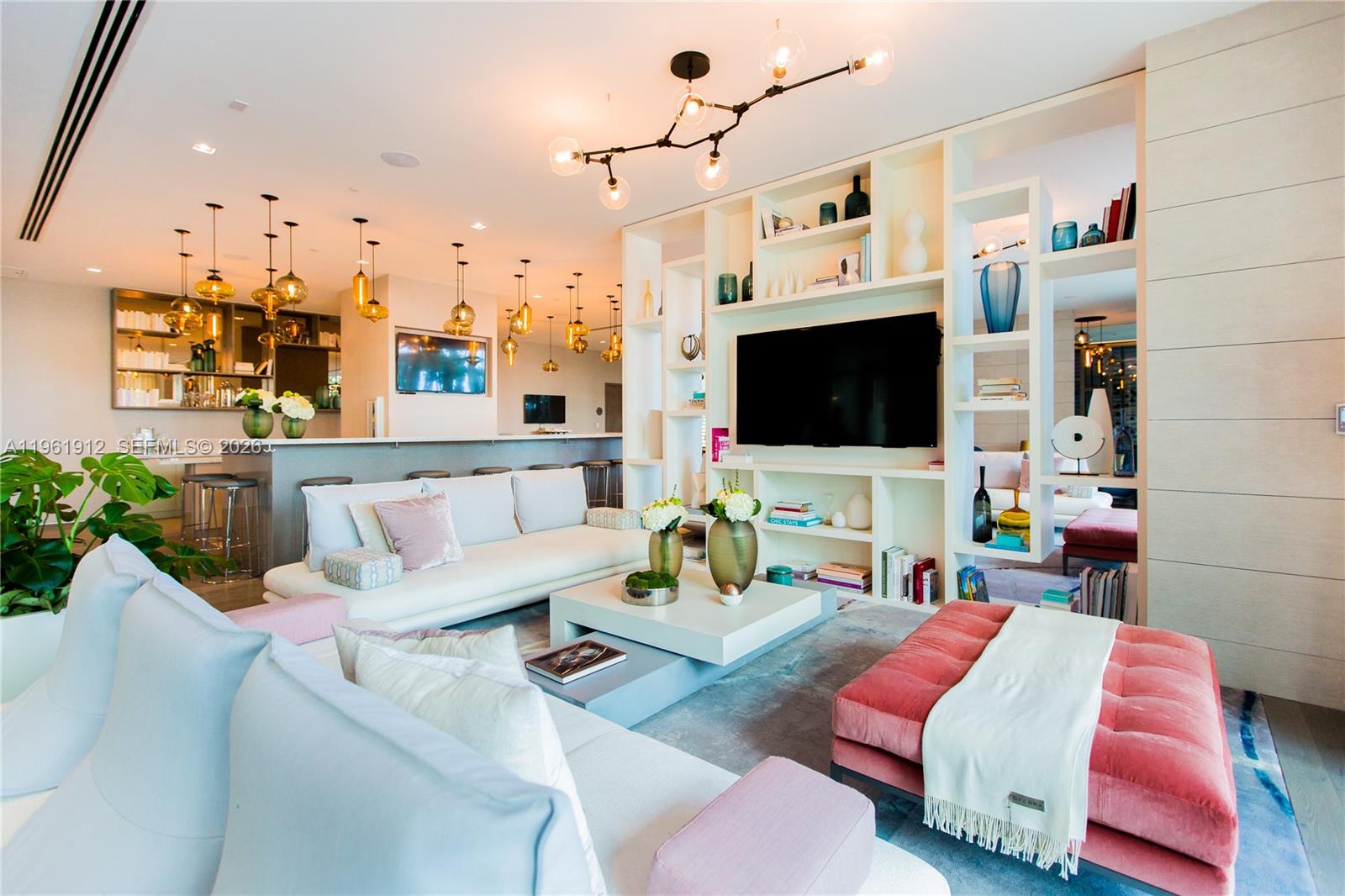 650 Northeast 32nd Street, Unit 2205 Miami, FL 33137 - Photo 37 of 56 a living room with furniture and a flat screen tv