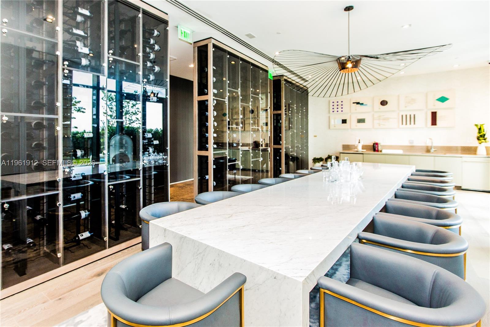 650 Northeast 32nd Street, Unit 2205 Miami, FL 33137 - Photo 40 of 56 a large kitchen with a table and chairs