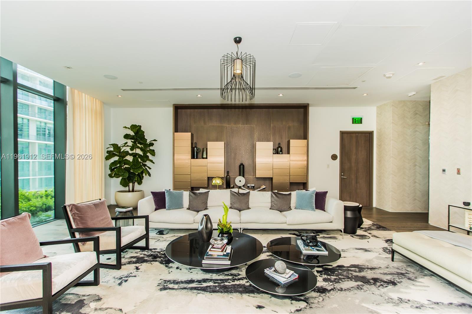 650 Northeast 32nd Street, Unit 2205 Miami, FL 33137 - Photo 43 of 56 a living room with furniture a window and potted plant