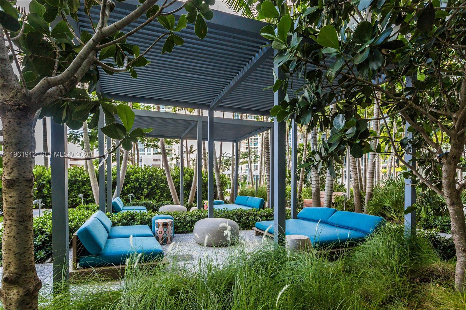 650 Northeast 32nd Street, Unit 2205 Miami, FL 33137 - Photo 46 of 56 a view of backyard with swimming pool and outdoor seating