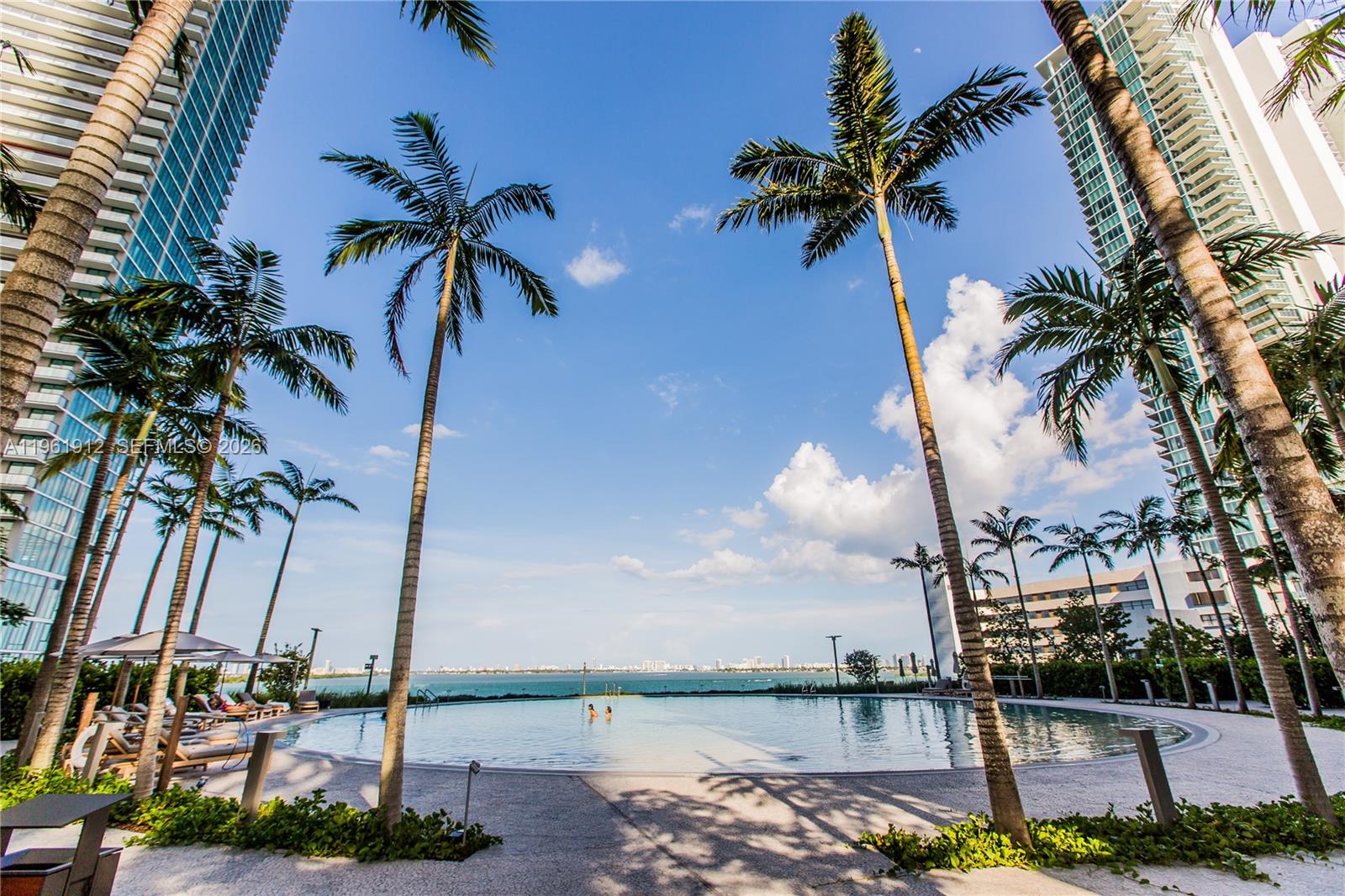 650 Northeast 32nd Street, Unit 2205 Miami, FL 33137 - Photo 50 of 56 a view of a palm tree next to a building