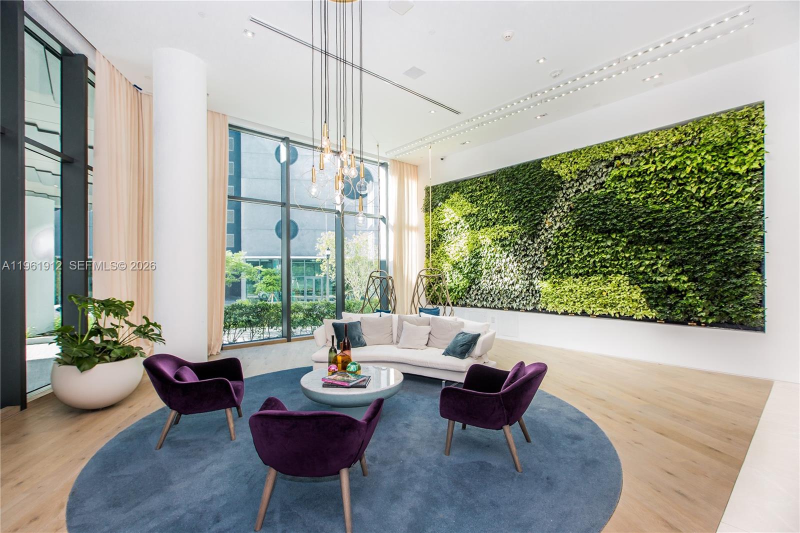 650 Northeast 32nd Street, Unit 2205 Miami, FL 33137 - Photo 53 of 56 a living room with furniture and a large window