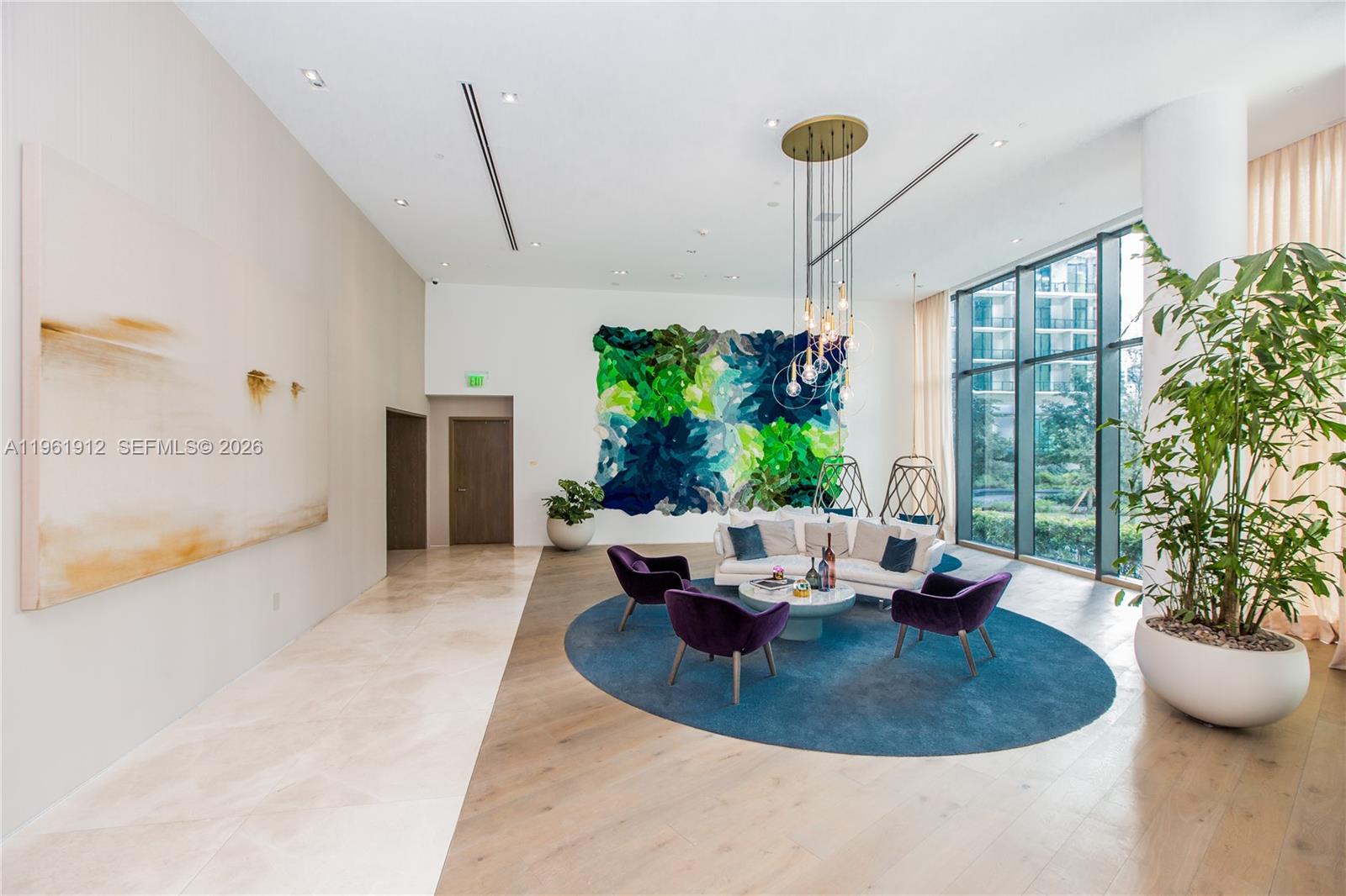 650 Northeast 32nd Street, Unit 2205 Miami, FL 33137 - Photo 55 of 56 a view of a dining room with furniture window and wooden floor