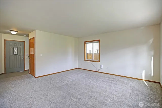 a view of an empty room and a window