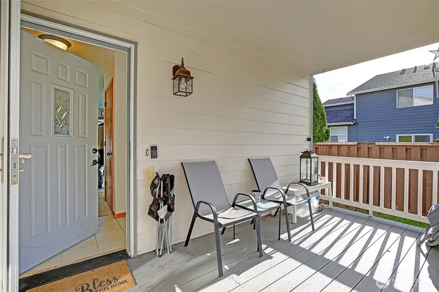 a view of a balcony with furniture