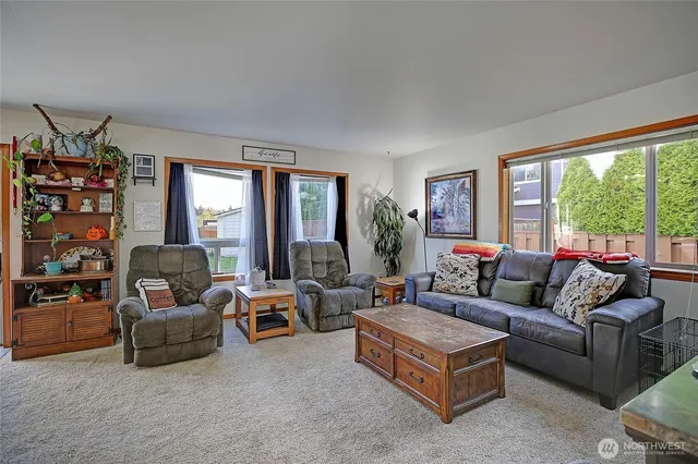 a living room with furniture and a large window