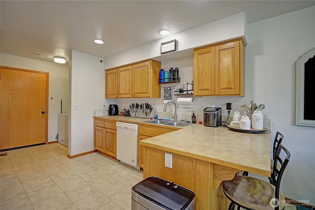 a kitchen with a sink stove and refrigerator