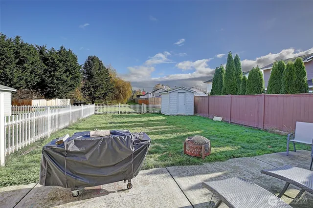 a view of a backyard with sitting area