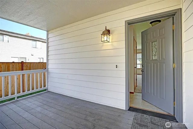a view of a house with wooden deck