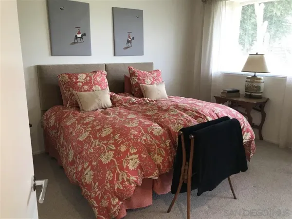 a bathroom with double sink and two mirror