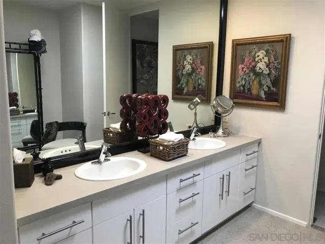 a bedroom with a bed and a table in it