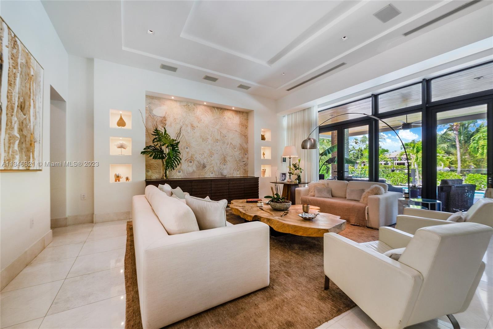 810 Jeronimo Drive Coral Gables, FL 33146 - Photo 15 of 41 a living room with furniture and a large window