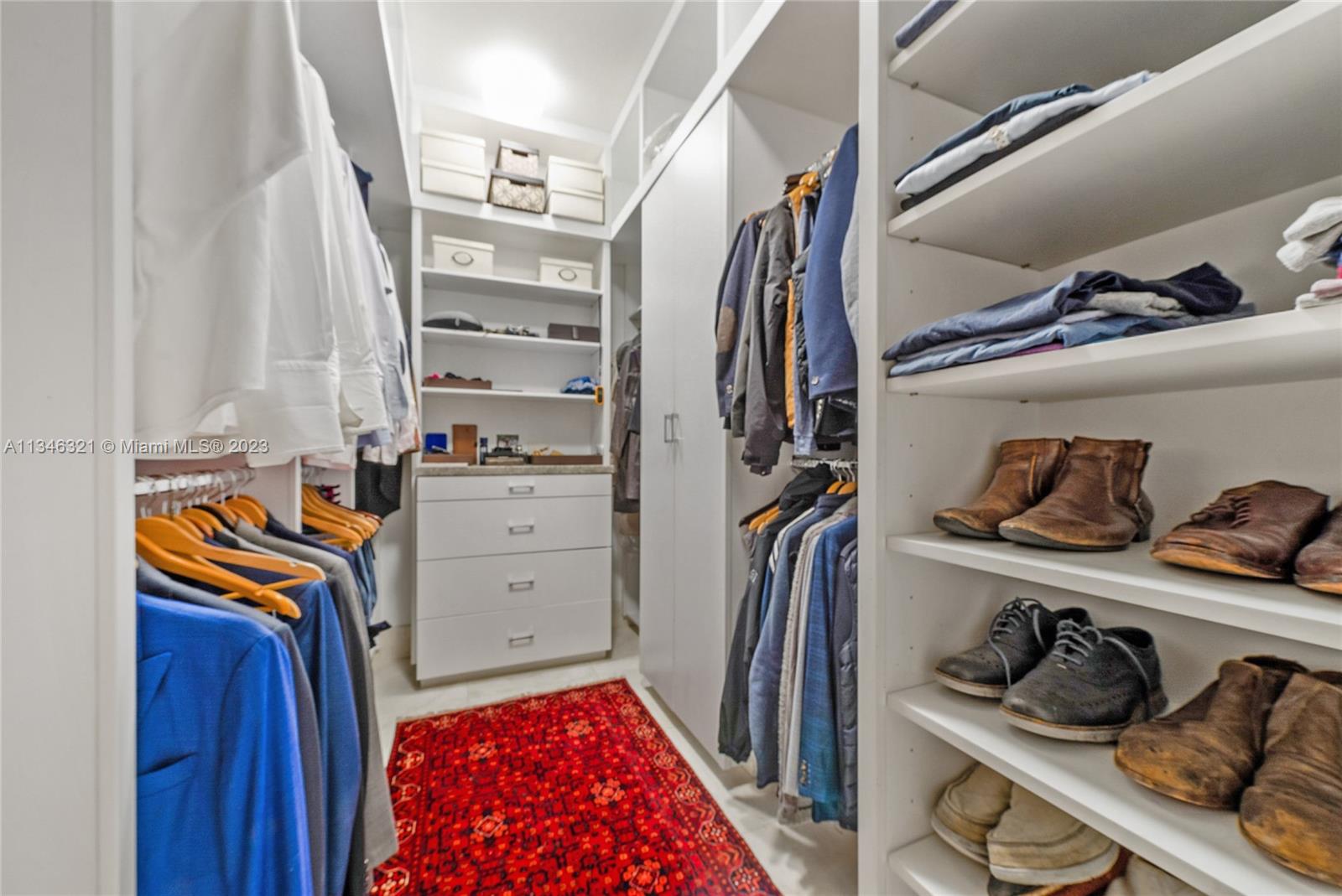 810 Jeronimo Drive Coral Gables, FL 33146 - Photo 29 of 41 a view of walk in closet with clothes and shoes