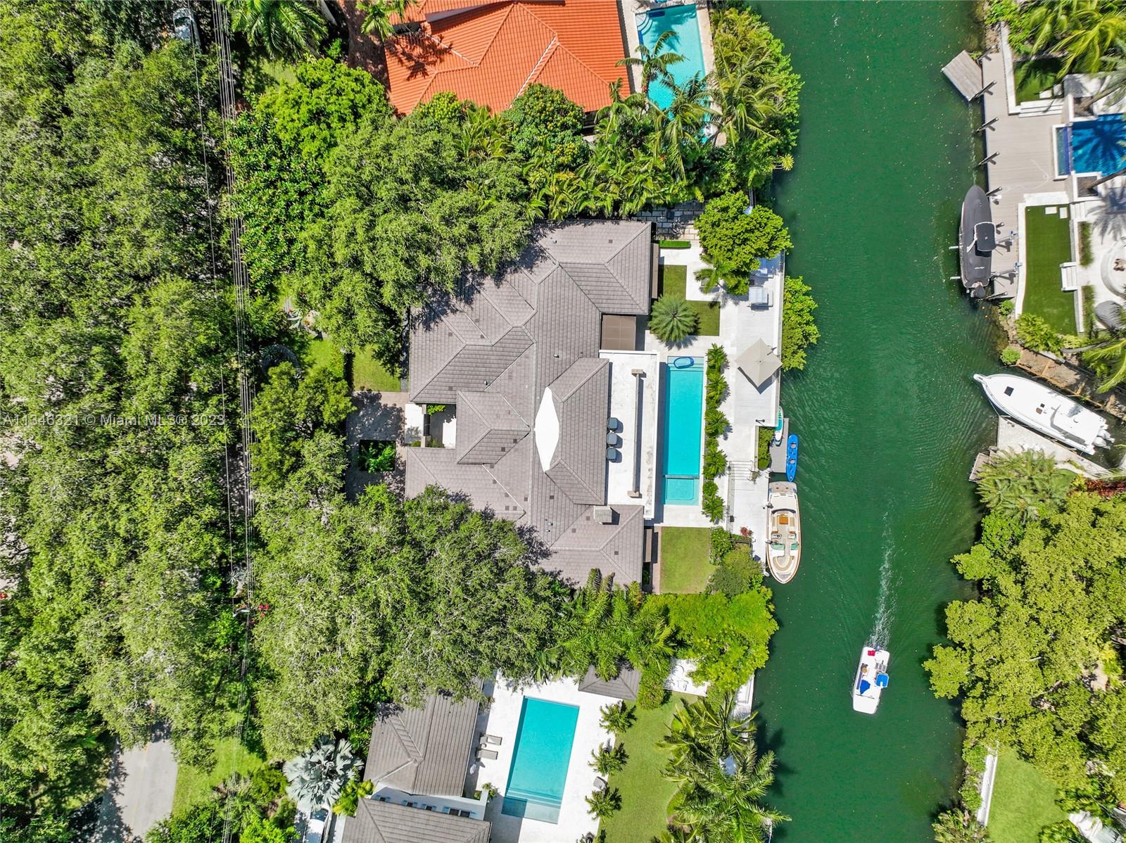 810 Jeronimo Drive Coral Gables, FL 33146 - Photo 3 of 41 an aerial view of a house with yard swimming pool and outdoor seating