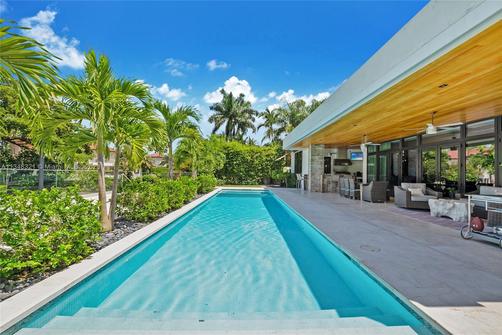 810 Jeronimo Drive Coral Gables, FL 33146 - Photo 31 of 41 a view of a backyard with plants and a patio
