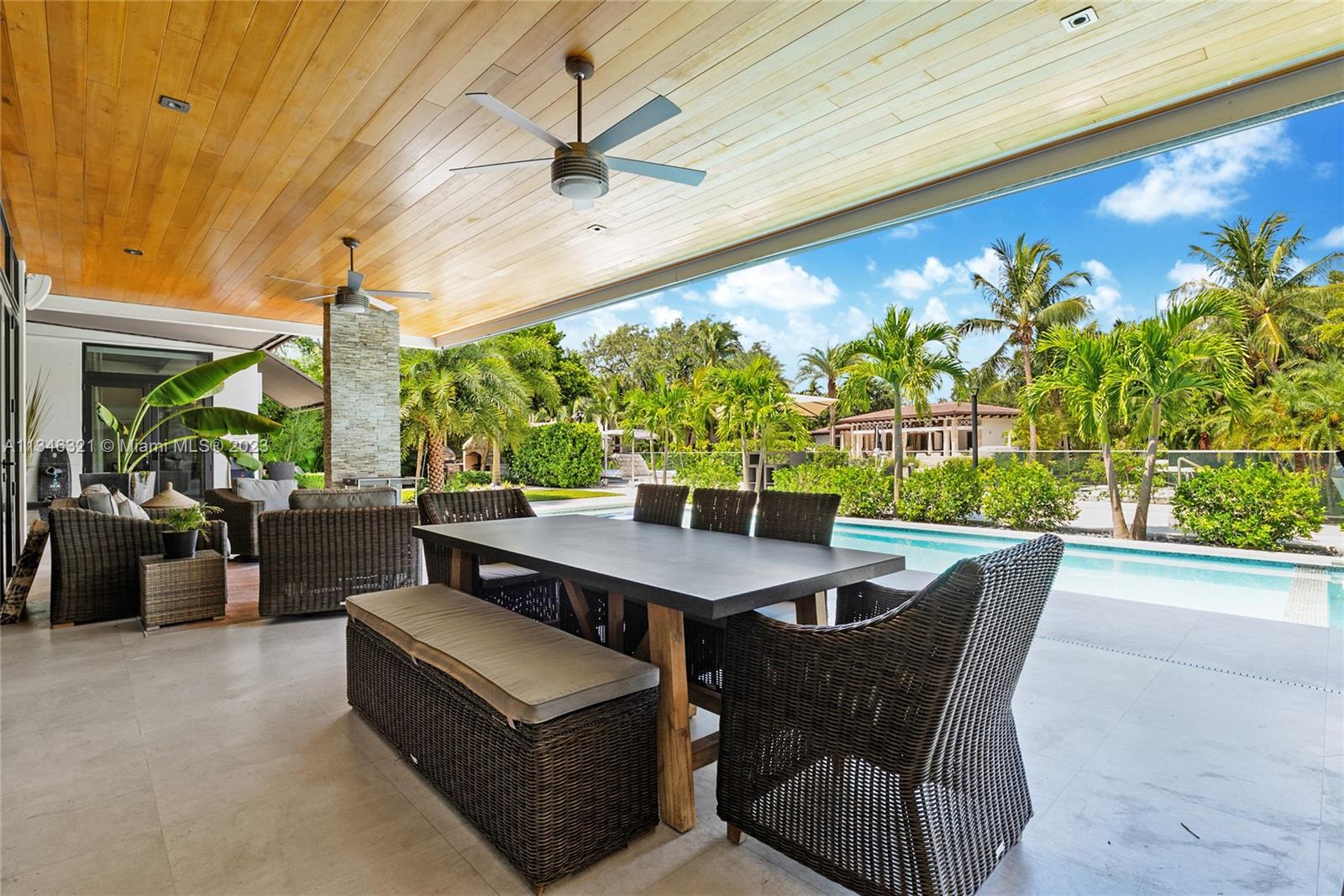 810 Jeronimo Drive Coral Gables, FL 33146 - Photo 32 of 41 a view of a patio with a table chairs and a table