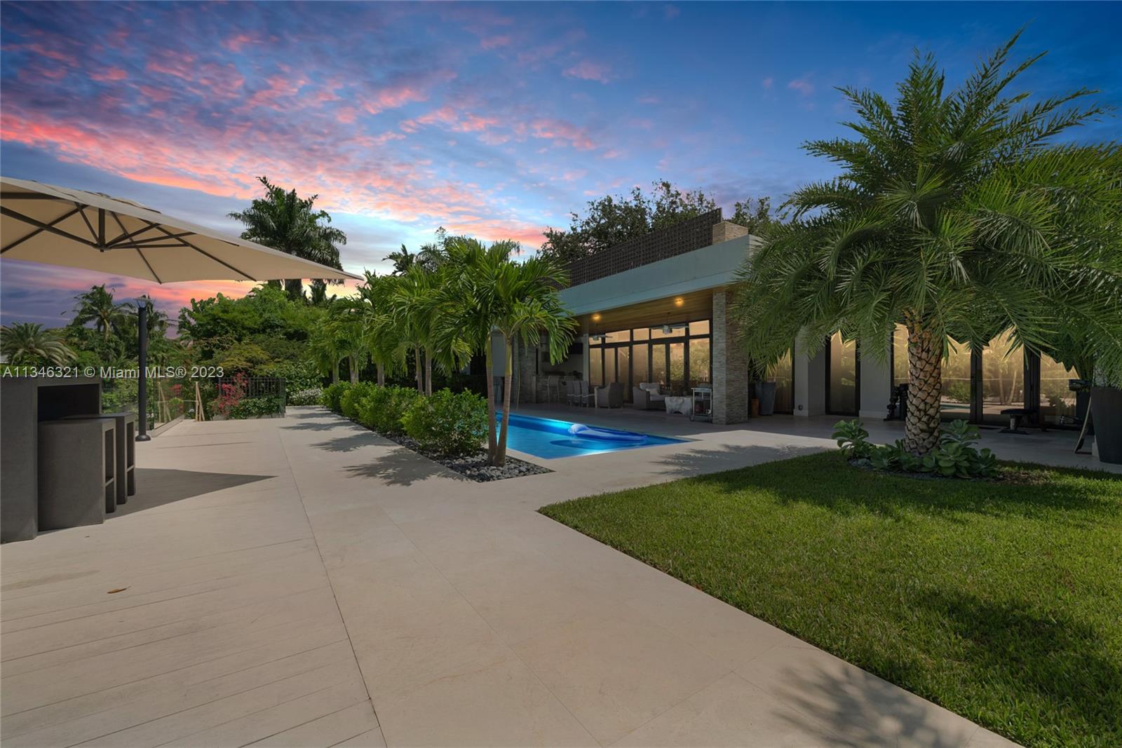 810 Jeronimo Drive Coral Gables, FL 33146 - Photo 40 of 41 a view of a swimming pool with a patio