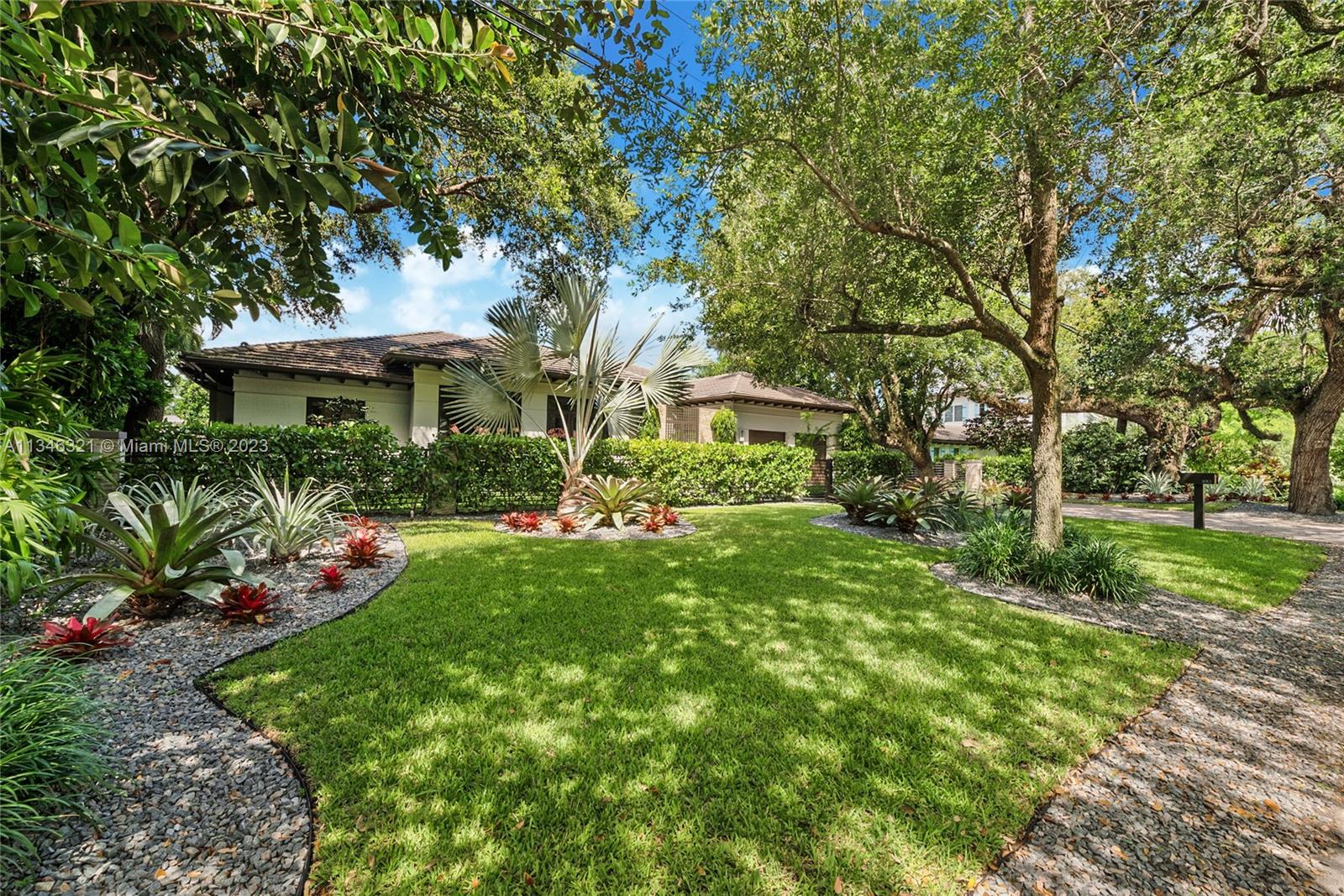 810 Jeronimo Drive Coral Gables, FL 33146 - Photo 8 of 41 a view of a house with a yard