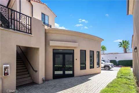 a view of a patio with a table and chairs