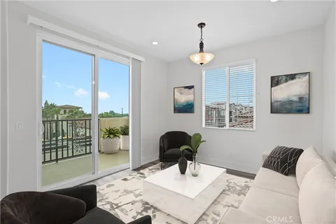 a view of a livingroom with furniture and a window