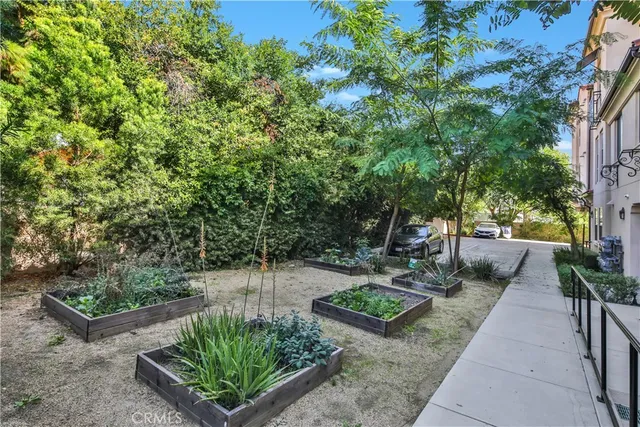 a view of a backyard with sitting area