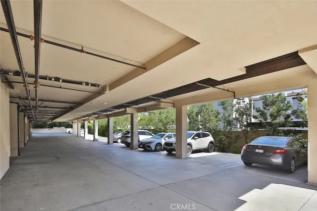 a view of parking garage with cars
