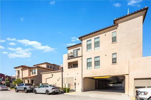 a couple of cars parked in front of a house
