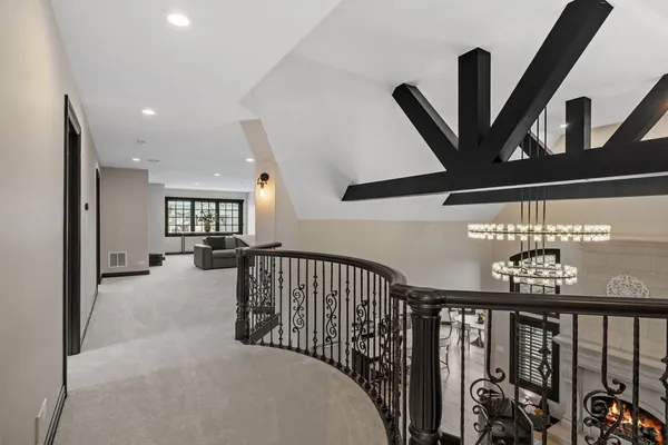 a view of a bedroom with a bed and a window