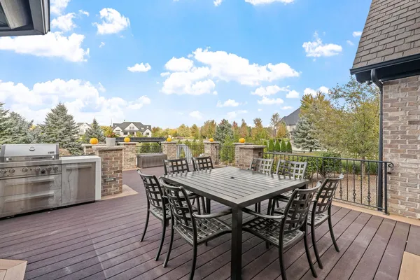a view of a swimming pool with a patio and a yard