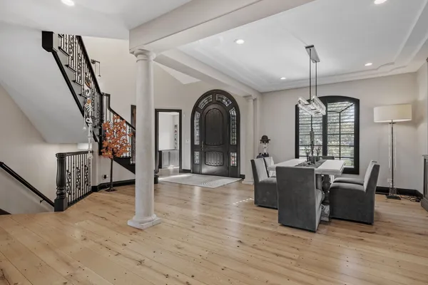 a view of a livingroom with furniture window and wooden floor