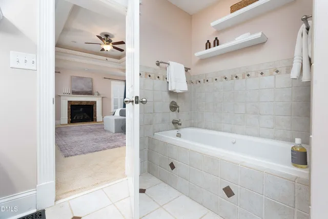 a bathroom with a bathtub and a shower
