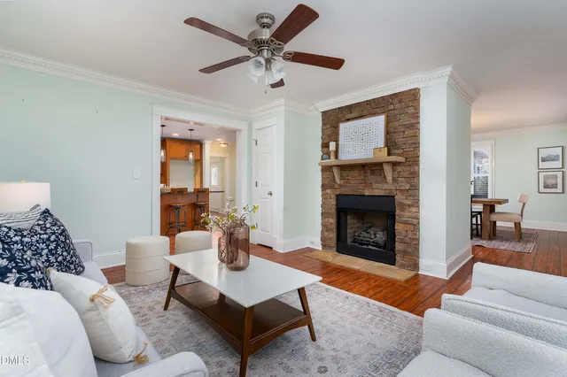 a living room with furniture and a fireplace