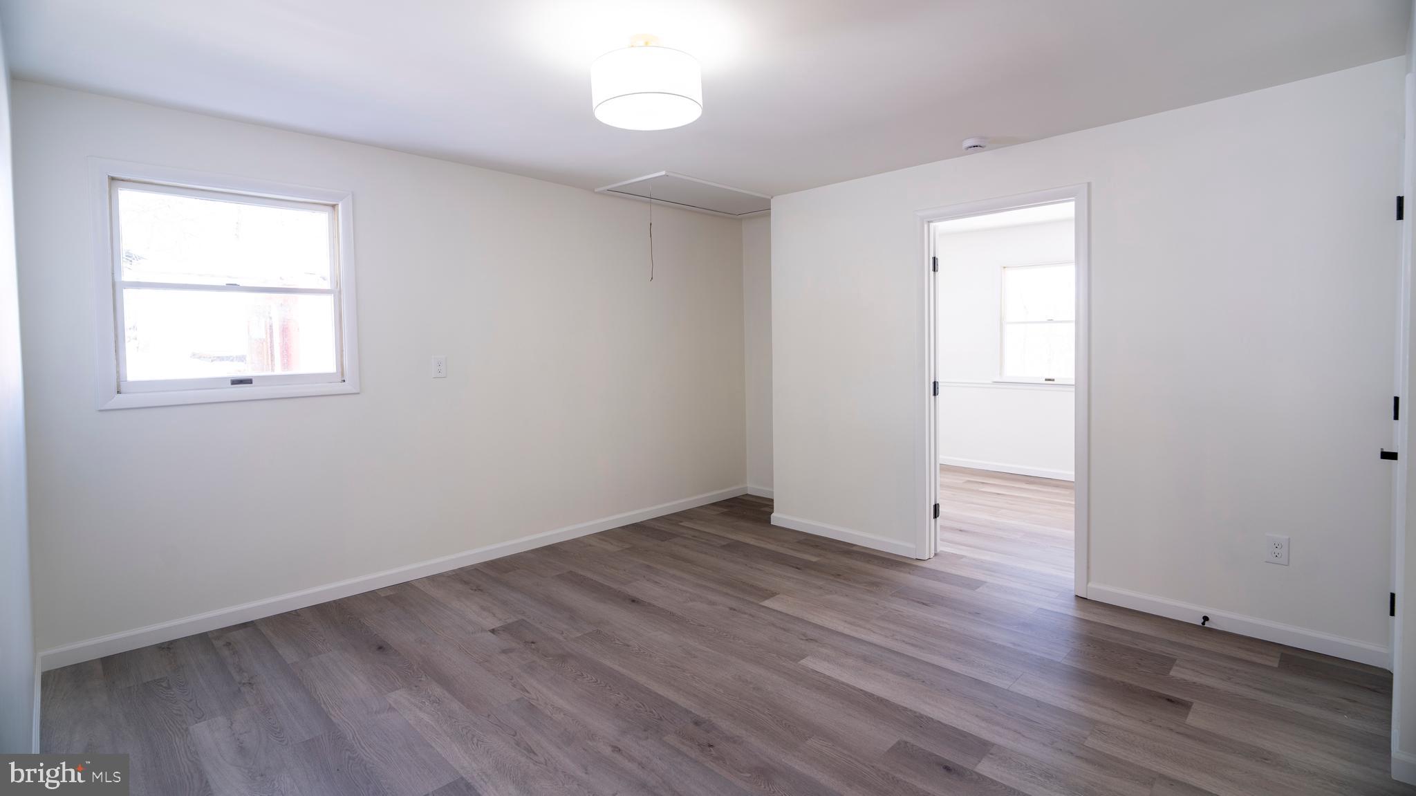 6152 Pigeon Hill Road Spring Grove, PA 17362 - Photo 25 of 35 an empty room with wooden floor and windows
