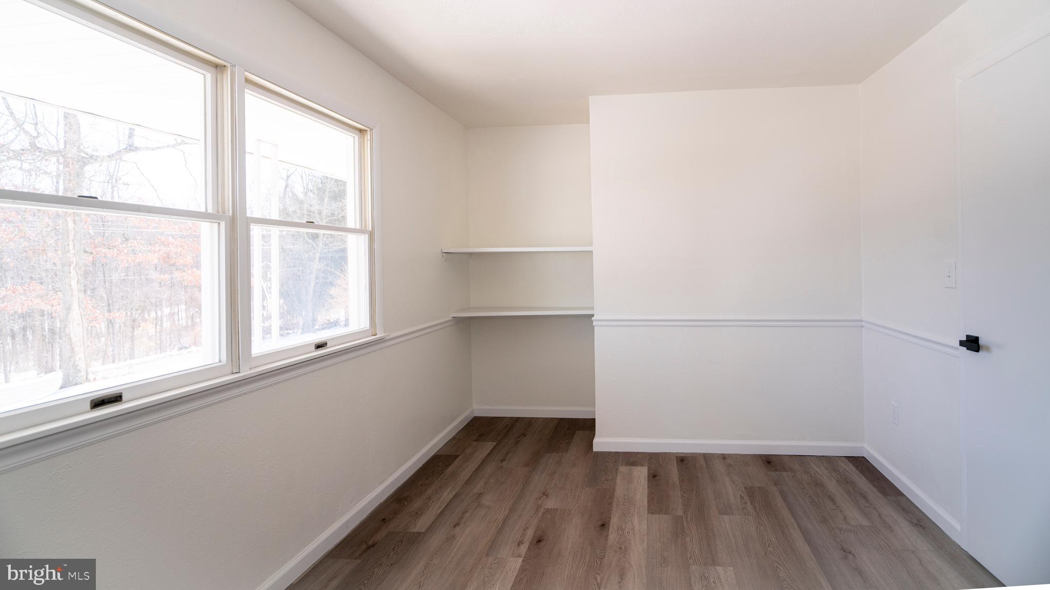6152 Pigeon Hill Road Spring Grove, PA 17362 - Photo 26 of 35 a view of a room with wooden floor and window