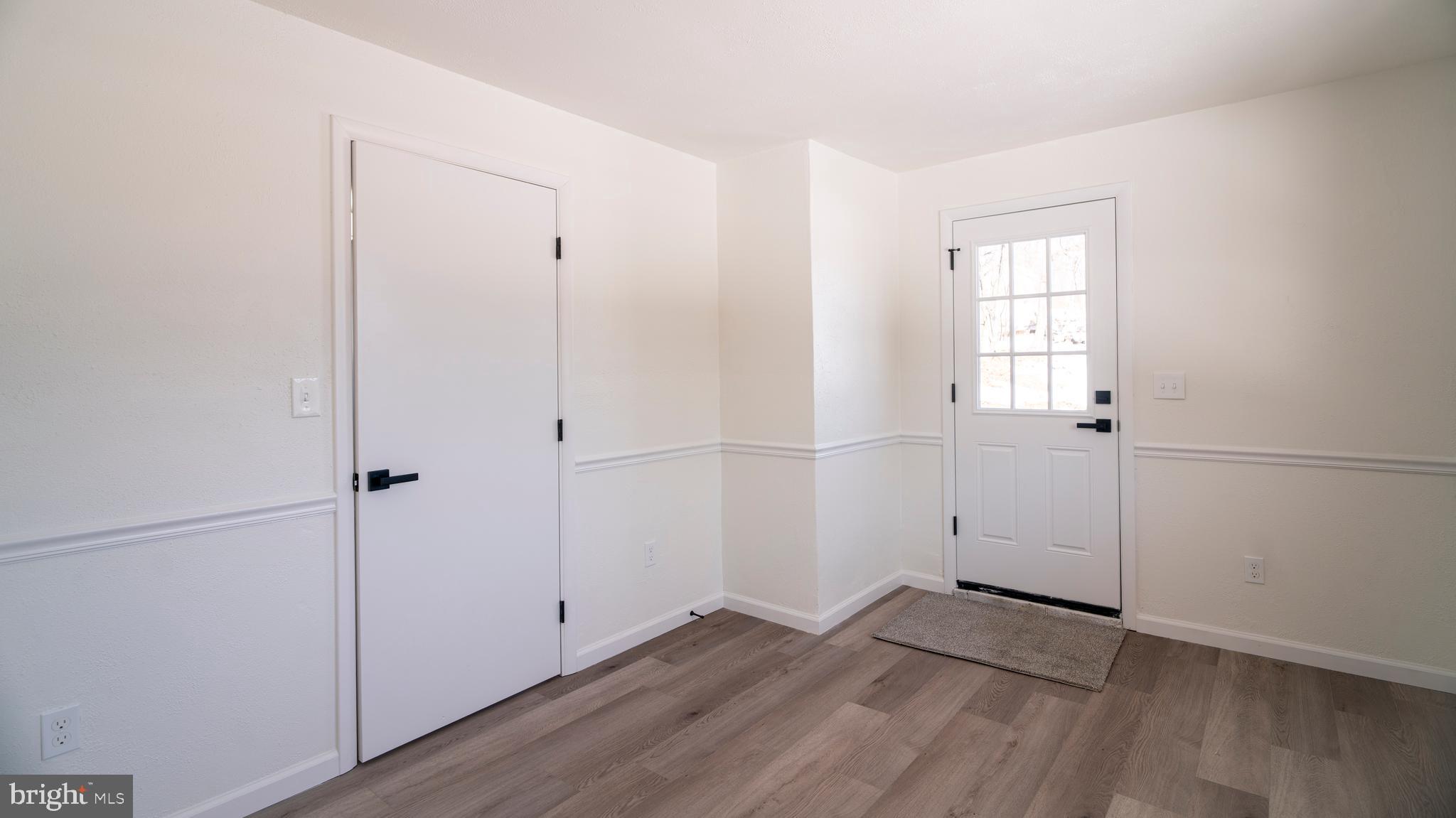 6152 Pigeon Hill Road Spring Grove, PA 17362 - Photo 27 of 35 an empty room with wooden floor and windows