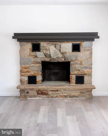a living room with fireplace