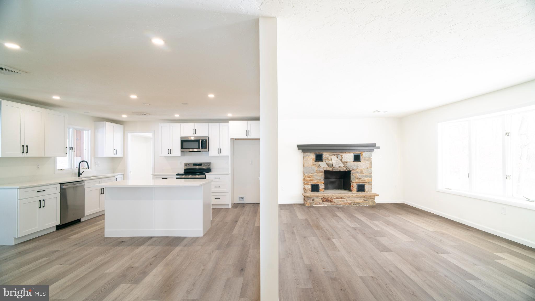 6152 Pigeon Hill Road Spring Grove, PA 17362 - Photo 6 of 35 a view of a kitchen with a sink cabinets and wooden floor