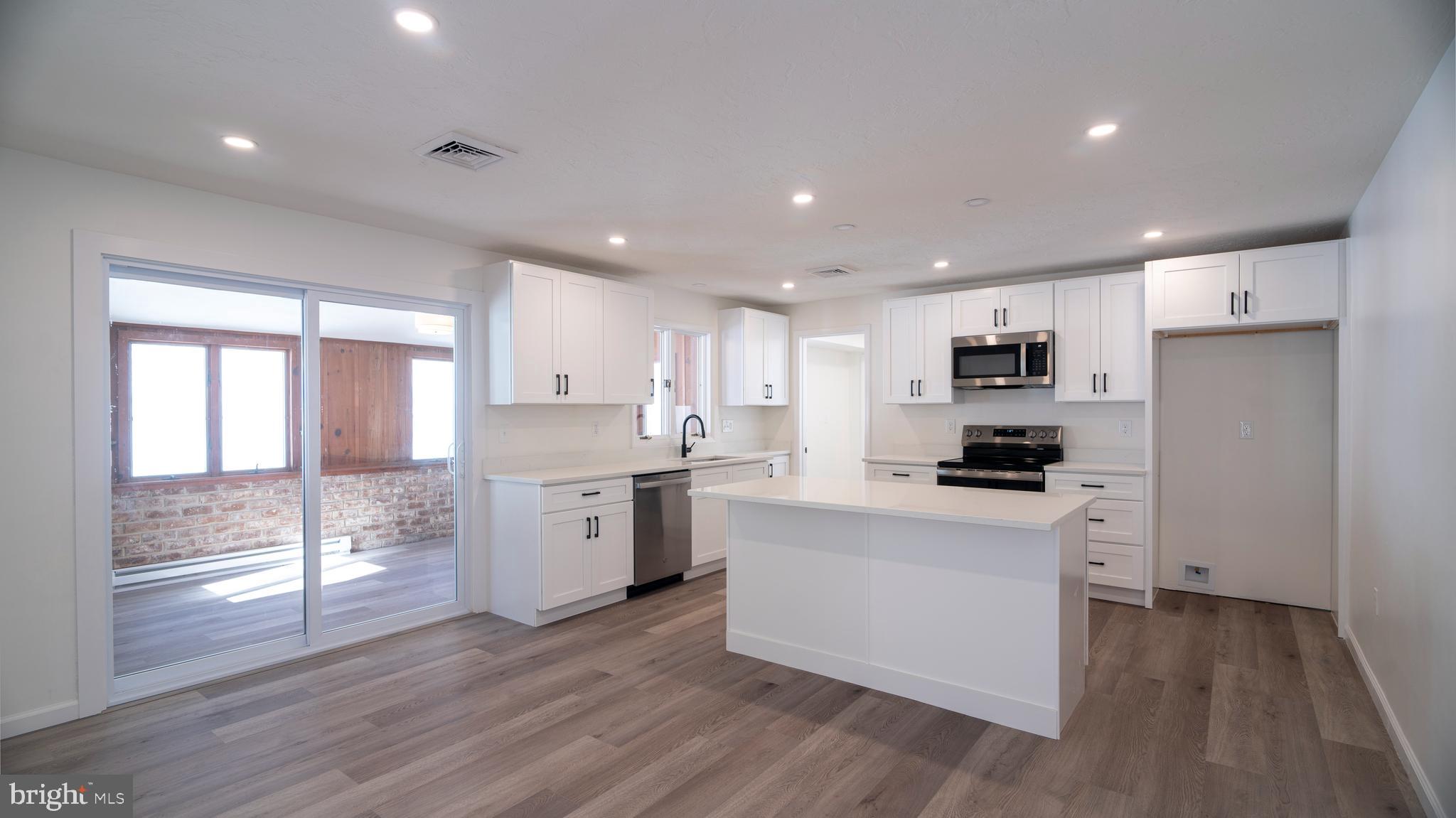 6152 Pigeon Hill Road Spring Grove, PA 17362 - Photo 7 of 35 a kitchen with stove a sink and a refrigerator