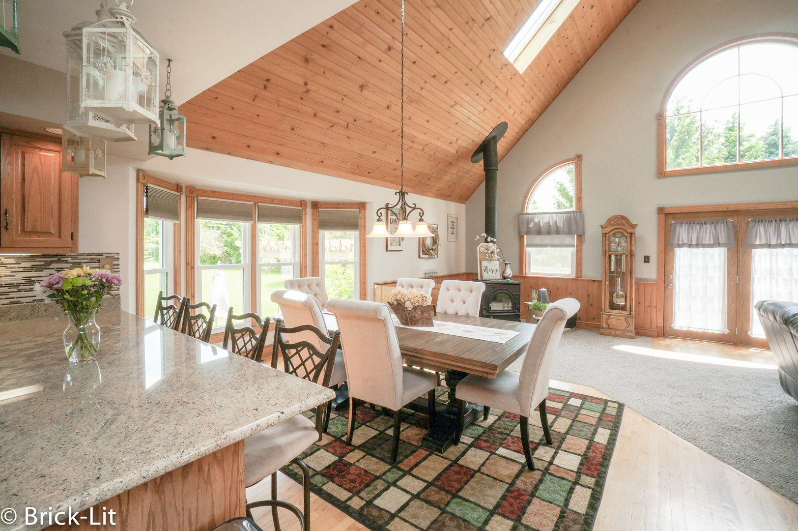 23959 South Schoolhouse Road Manhattan, IL 60442 - Photo 16 of 31 a dining room with furniture a chandelier and wooden floor