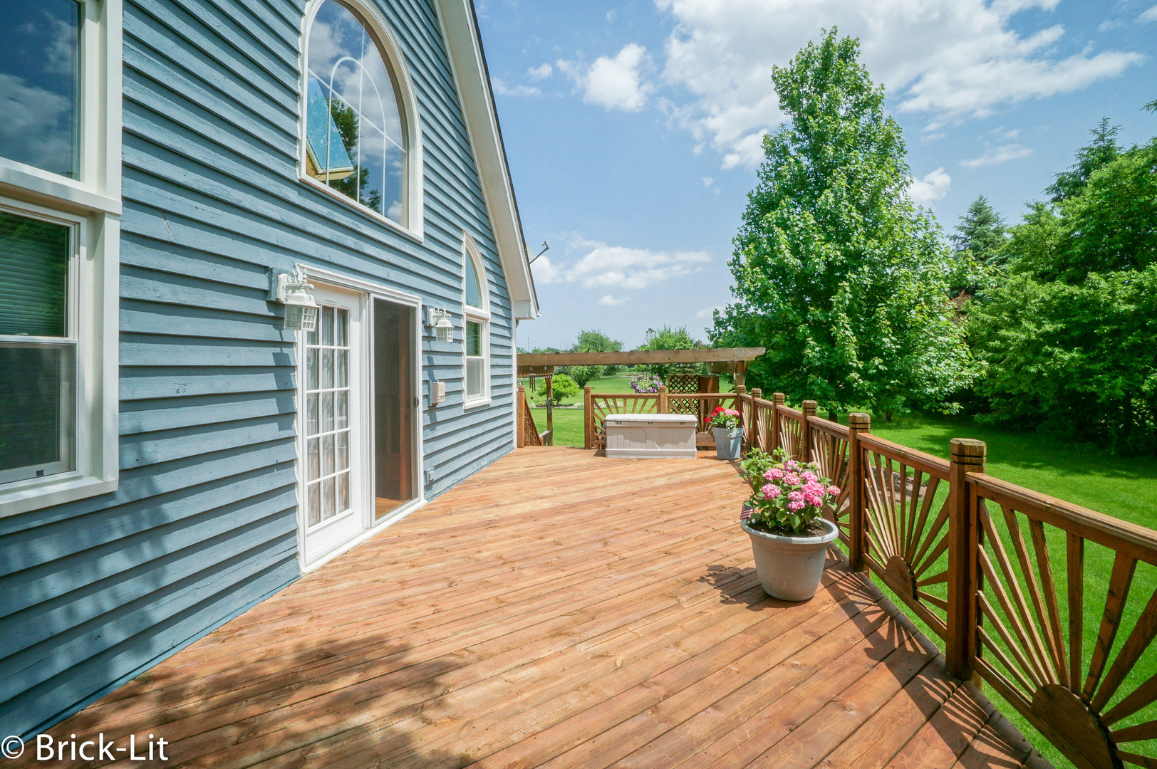 23959 South Schoolhouse Road Manhattan, IL 60442 - Photo 10 of 31 a view of a balcony with two chairs and a potted plant