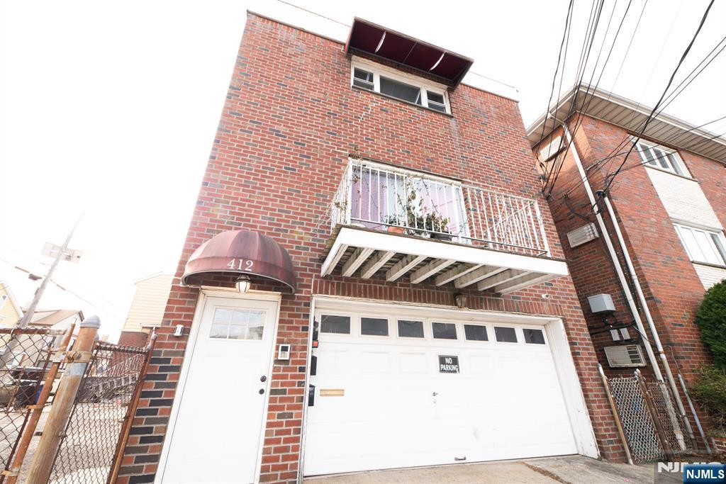 412 Walker Street, Unit 1 Fairview, NJ 07022 - Photo 1 of 10 a front view of a building