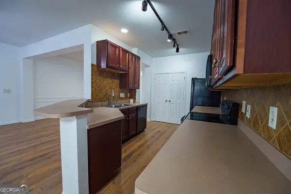a kitchen with a stove and a microwave